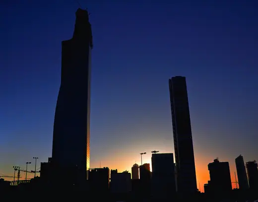 Photo 6: Context · Kuwait Skyline with Al Hamra Tower under construction at sunset