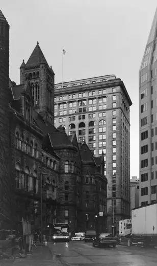 Photo 3: Exterior · View westward on Fifth Avenue, Pittsburgh, with the Allegheny County Courthouse and the Frick Building