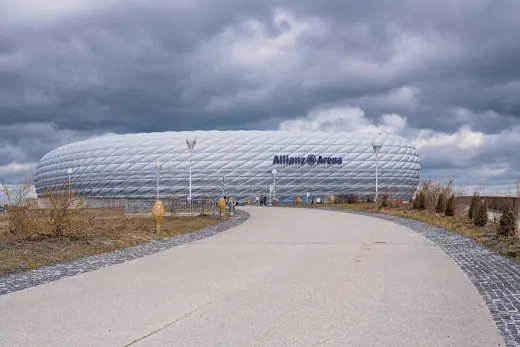 Photo 3: Exterior · The Allianz Arena in Munich with cloudy sky