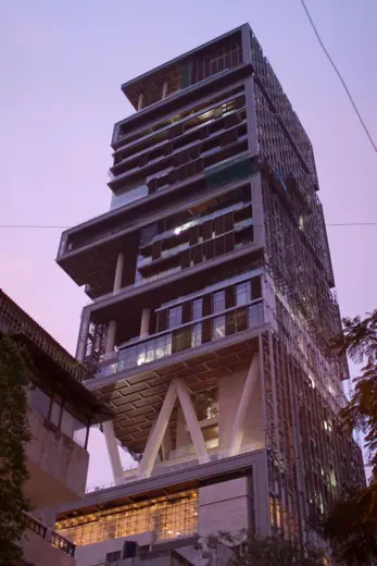Photo 4: Exterior · A view of Mukesh Ambani's skyscraper/house from Altamount Rd at dusk