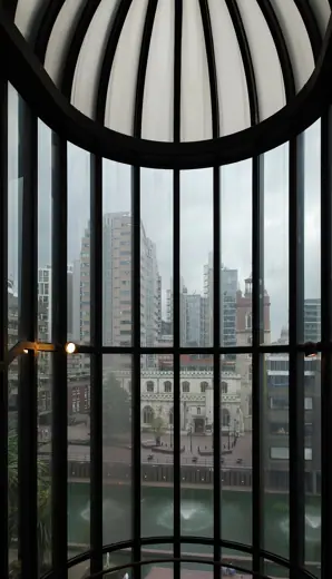 Photo 5: Interior · Looking out over the City of London from the staircase of the Barbican Centre 