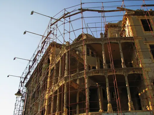 Photo 3: Exterior · Bullet hole building