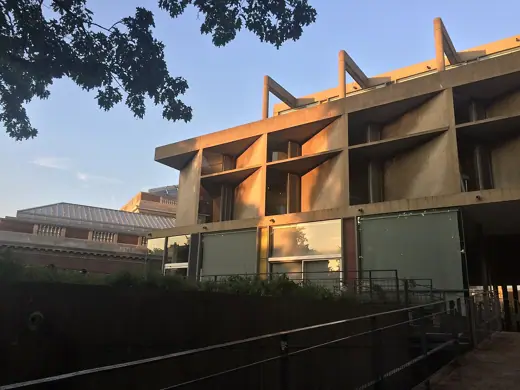 Photo 6: Detail · A view leading up from the ramp showing this side's angled windows