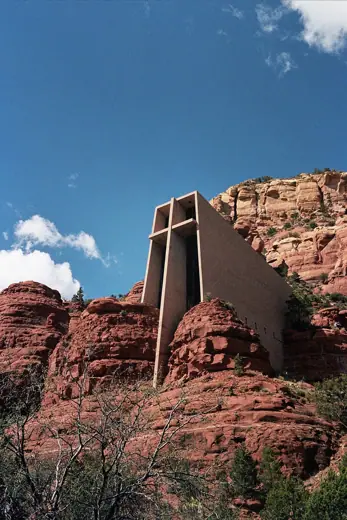 Photo 1: Exterior · Chapel of the Holy Cross in Sedona, Arizona, pictured from below on Chapel rd