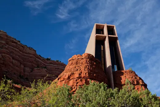 Photo 2: Exterior · A picture of the Chapel of the Holy Cross in Sedona, Arizona near sunset