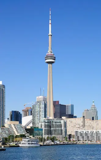 Photo 2: Exterior · The CN Tower and the Toronto Harbour viewed from the Toronto City Centre Airport