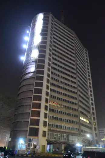 Photo 5: Context · Night view of one of the oldest storey buildings in Nigeria (ibadan)