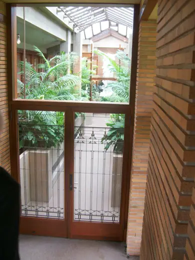 Photo 6: Interior · Photo of the entrance to the conservatory from the pergola in the Darwin D Martin House by Frank Lloyd Wright