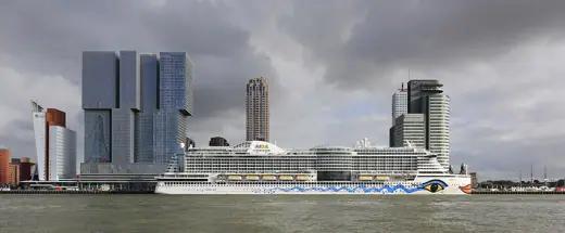 Photo 2: Exterior · AIDAperla at Wilhelminapier in Rotterdam with the high-rises De Rotterdam and World Port Center 