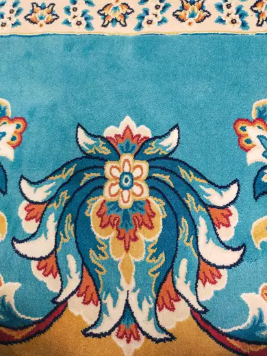 Photo 2: Exterior · The prayer rug of Djamaâ El Djazaïr, a luxurious turquoise carpet, covers an area of 27,000 square meters
