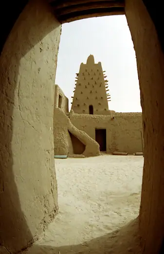 Photo 4: Exterior · Djinguereber Mosque is one of three ancient centers of learning located in Timbuktu, Mali, Africa