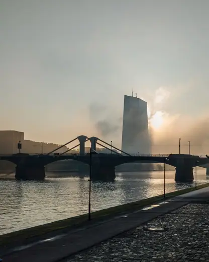 Photo 4: Exterior · Contre-jour view of ECB tower in the morning fog shortly after sunrise