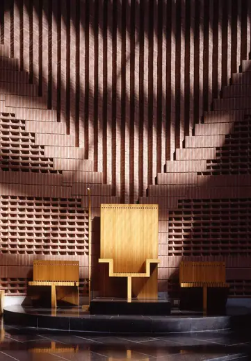 Photo 5: Interior · Celebrant's chair by the altar in Evry Cathedral