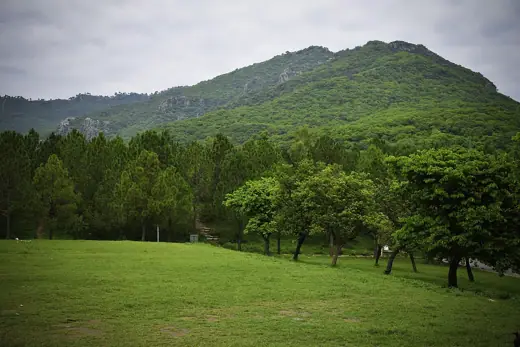 Photo 4: Exterior · Margalla Hills behind the Faisal Mosque