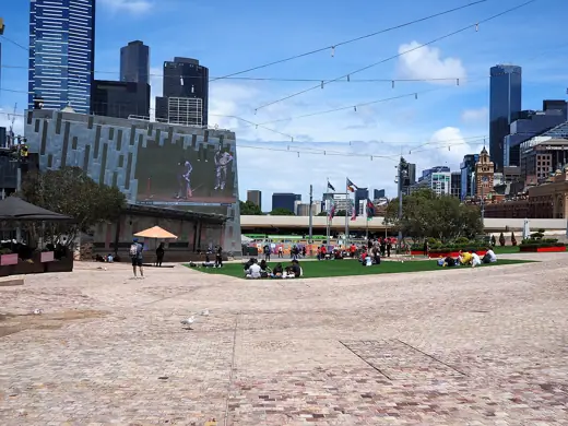 Photo 4: Exterior · Part of Federation Square, with the Boxing Day test match being broadcast