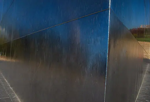 Photo 6: Detail · Shiny silver panel and welds on the Gateway Arch shot close-up so the blue sky is reflected in the steel