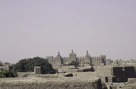 Photo 2: Exterior · The mosque of Djenné with three broad minarets in one side