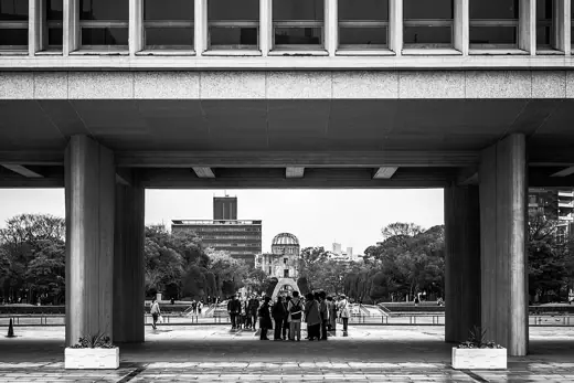 Photo 7: Detail · Between the columns of the Hiroshima Peace Museum, the Genbaku Dome can be seen in the far distance