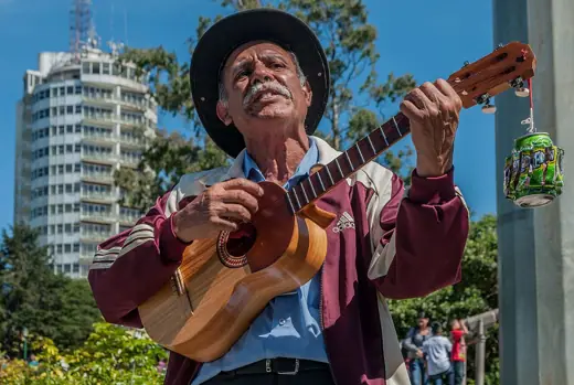 Photo 2: Exterior · Man singing for money near the Hotel Humboldt , Caracas, Venezuela