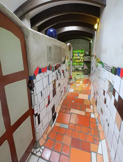 Photo 6: Interior · Inside men's toilets at Hundertwasser toilets in Kawakawa