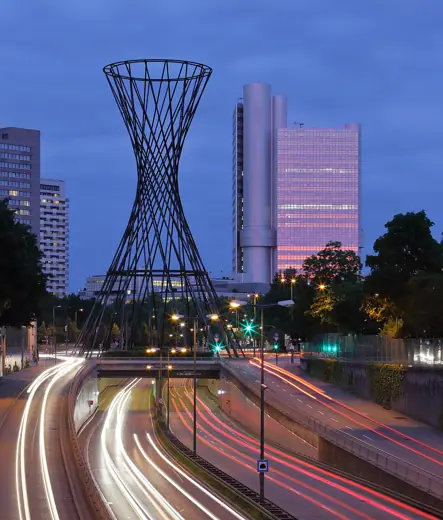 Photo 6: Detail · Munich's HVB Tower and "Mae West" , a sculpture on Effnerplatz, at dusk