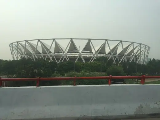 Photo 1: Exterior · View of Jawaharlal Nehru Stadium Delhi from Barapullah flyover