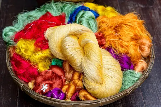 Photo 3: Exterior · Hanks of dyed silk thread at the Jim Thompson House, Bangkok