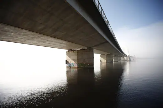 Photo 2: Exterior · underside of the JK Bridge in Brasilia, DF Brazil dissapearing into the morning fog