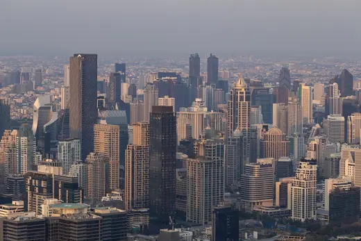 Photo 2: Exterior · Skyscrapers of Bangkok during a sunset from Mahanakhon terrace