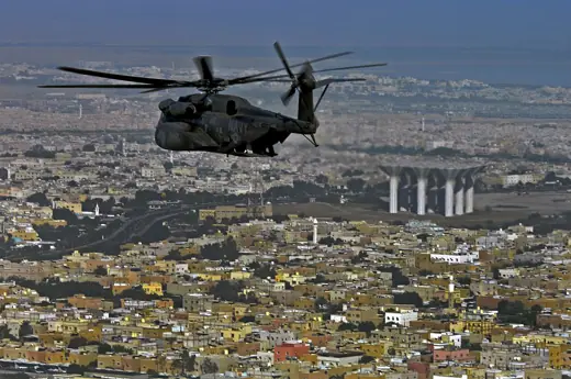 Photo 4: Detail · Participants of the Joint Civilian Orientation Conference 72 fly in a MH-53 Sea Dragon over Kuwait, Oct