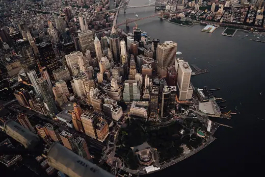 Photo 4: Interior · High-angle aerial view of the Financial District in Lower Manhattan, New York City, taken at dusk