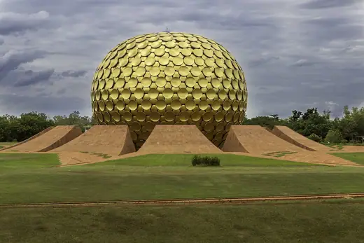 Photo 5: Interior · The Matrimandir, a golden metallic sphere in the center of town