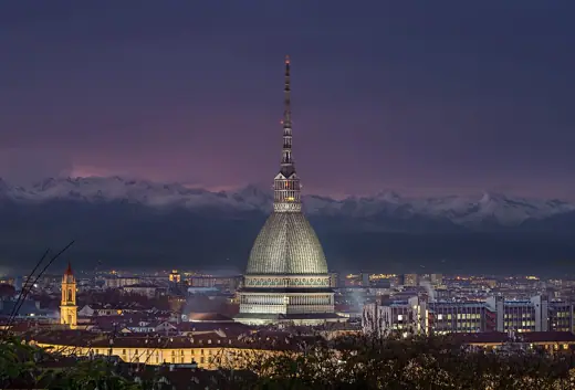 Photo 2: Exterior · Mole Antonelliana (Turin, Piedmont, Italy) by night with Alps in the background