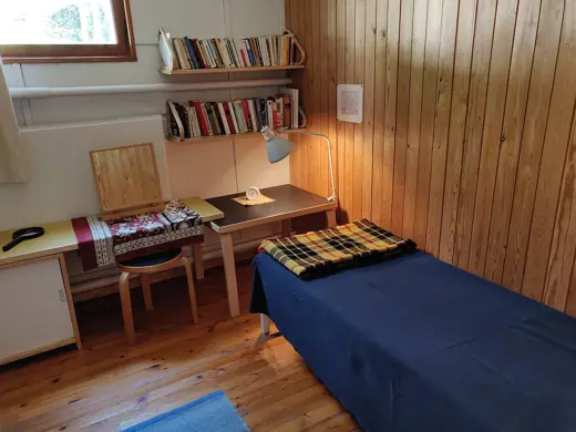 Photo 6: Interior · A room that has a bed and a desk