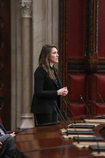 Photo 6: Interior · speaks on a resolution during session