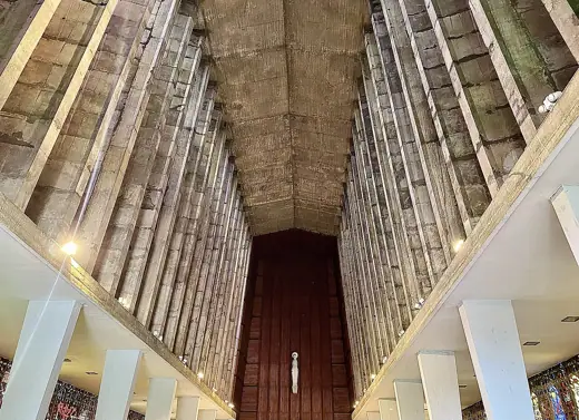 Photo 2: Interior · Vaulted concrete ceiling