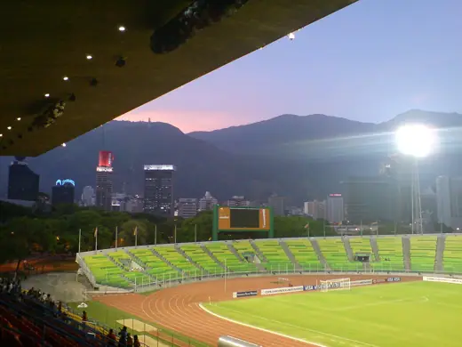 Photo 5: Context · Olympic Stadium of the Central University of Venezuela, viewing towards Plaza Venezuela at dusk