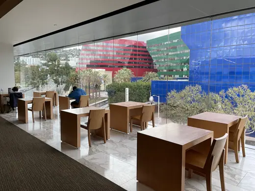 Photo 5: Interior · A reading room at the West Hollywood Library overlooking the Pacific Design Center in December 2023