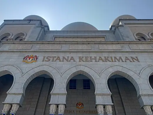Photo 1: Exterior · The immediate front facade of the Palace of Justice in Putrajaya, with the sign of "Istana Kehakiman" on top