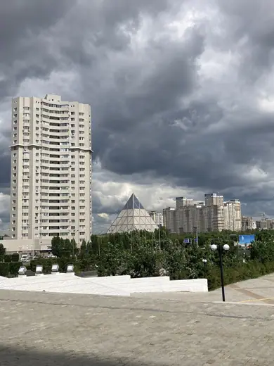 Photo 3: Exterior · Palace of Peace and Reconciliation (pyramid) and residential buildings