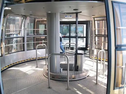 Photo 2: Interior · Interior of an empty tram car with revolving floor at the Palm Springs Aerial Tramway
