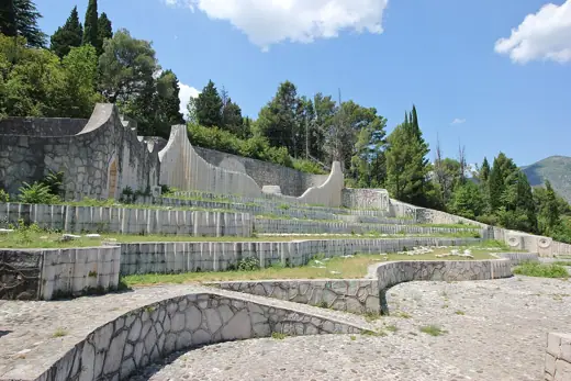 Photo 3: Exterior · The Partisan Memorial Cemetery in Mostar , the day before 700 namestones were destroyed by vandals