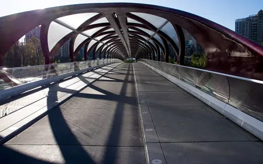 Photo 2: Exterior · Peace Bridge accommodates people walking and cycling across the Bow River in Calgary, Alberta, Canada