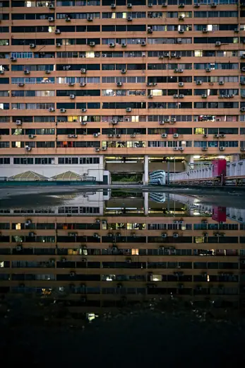 Photo 4: Interior · People's Park Complex taken from its rooftop, showing reflection off a puddle of rainwater