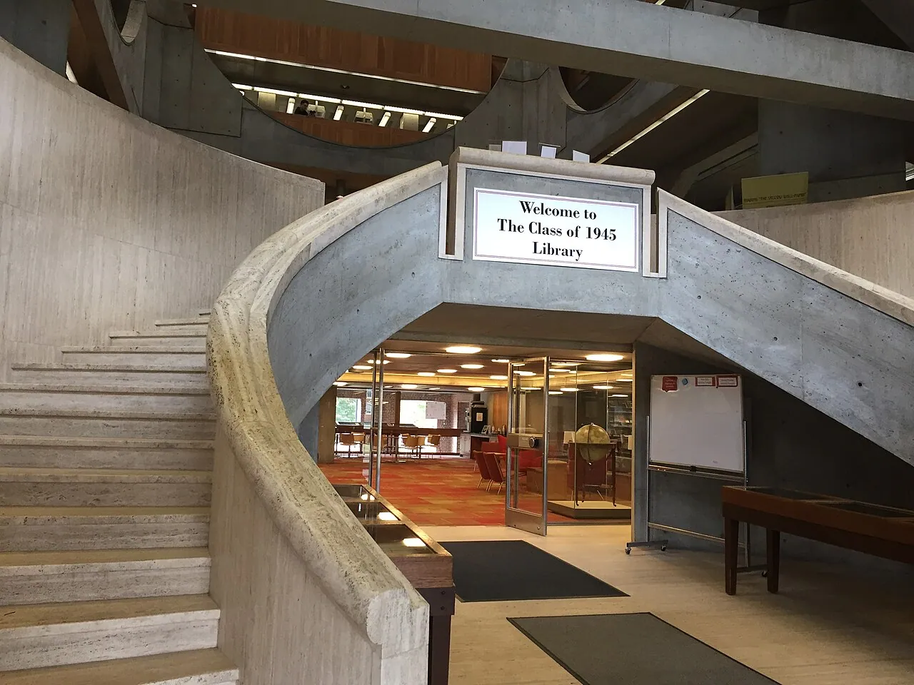 Phillips Exeter Academy Library: Interior · Curved travertine double staircase at library entrance