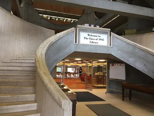 Photo 6: Interior · Curved travertine double staircase at library entrance