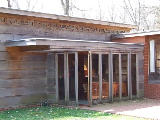Photo 5: Interior · Exterior of Pope-Leighey House, with dining room visible through full-length windows
