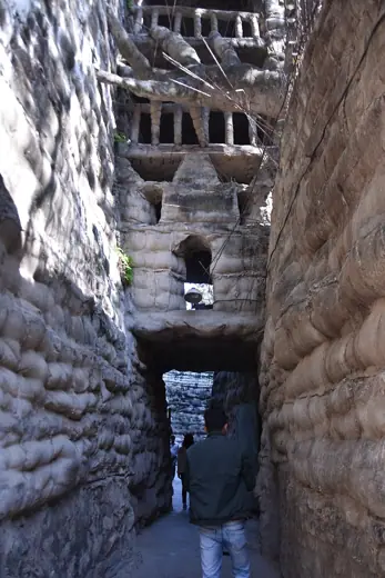 Photo 2: Interior · Elsewhere in Nek Chand's Rock Garden, a narrow pass inside a giant fortress