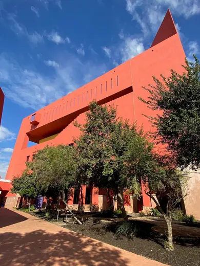 Photo 2: Exterior · The downtown library opened in 1995 and features a modern Mexican design