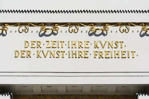 Photo 5: Interior · Secessionist motto at the façade of Secession Building , Vienna, Austria